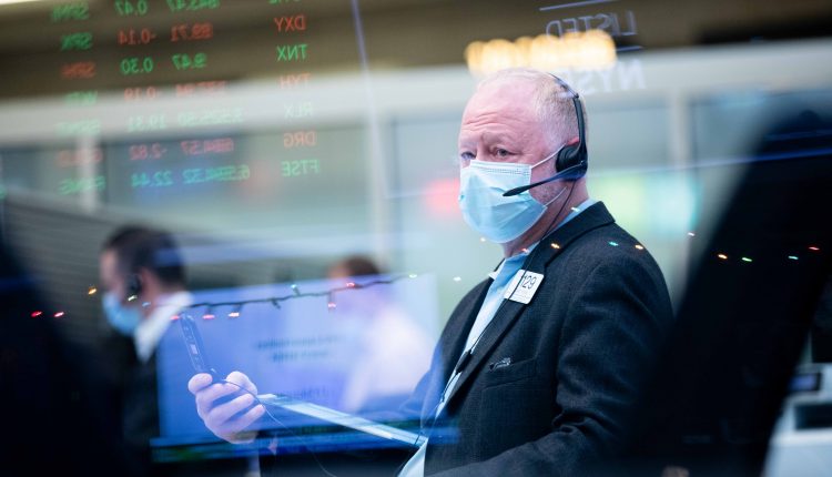 Stock futures are rising slightly after Wall Street hit record highs

