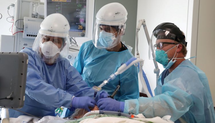 Covid deaths in the US hit another record as researchers in Ohio find two new variants

