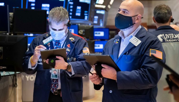 Stock futures rise slightly after Dow closes at record high

