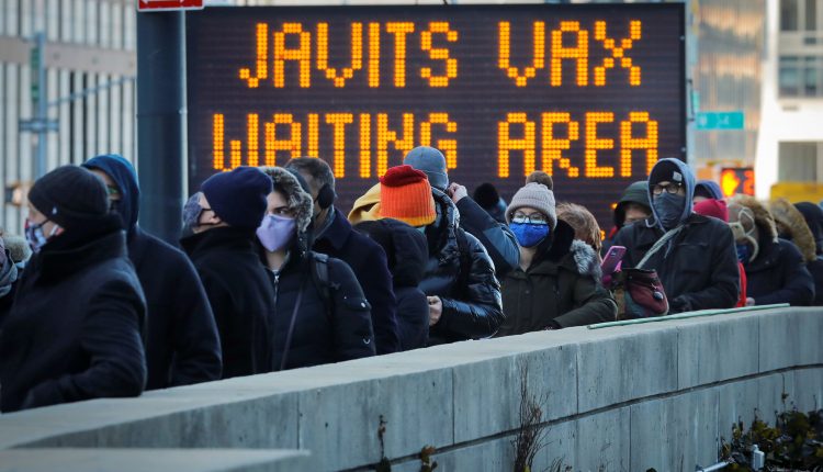 US vaccinations hit record, officials warn of easing restrictions

