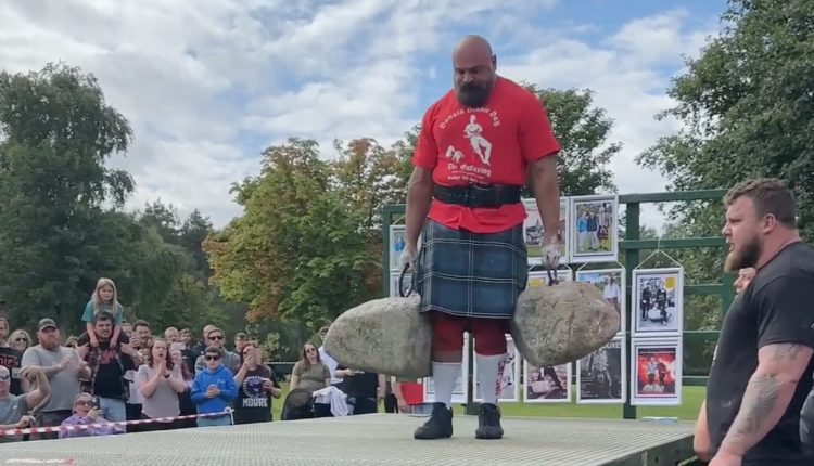 Laurence Shahlaei Sets Dinnie Stone Carry World Record of 22 Feet, 4 Inches