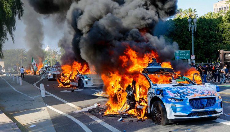 Photos show Waymo vehicles during La protests on fire


