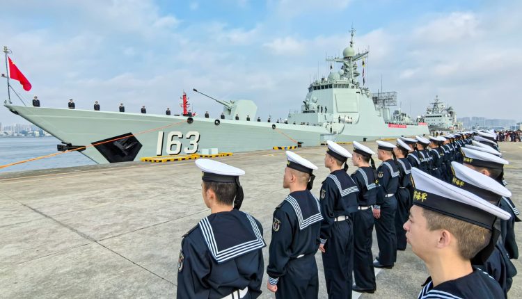 China says it has driven away the US warship near the controversial Scarborough Shoal

