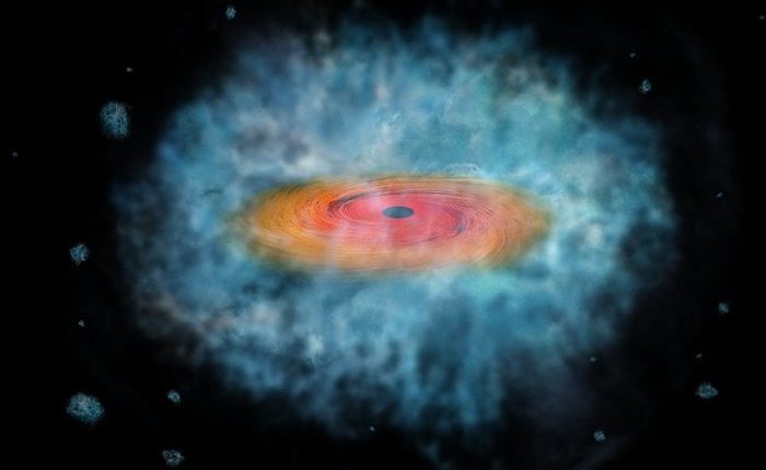 Artist's impression of a black hole see forming a galaxy around it. Credit - NASA/CXC/M. Weiss