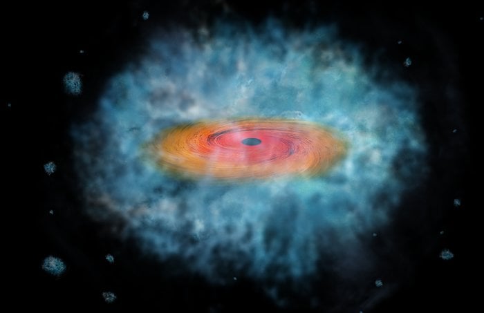 Artist's impression of a black hole see forming a galaxy around it. Credit - NASA/CXC/M. Weiss